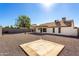 Expansive backyard with a patio, desert landscaping, and clear blue skies for serene outdoor living at 7326 W Georgia Ave, Glendale, AZ 85303