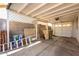 Spacious garage with block wall construction, exposed ceiling, and ample storage space at 7326 W Georgia Ave, Glendale, AZ 85303