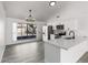 Modern kitchen with stainless steel appliances, white cabinets, and stylish gray flooring at 7326 W Georgia Ave, Glendale, AZ 85303