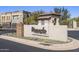 Elegant community entrance sign with stone accents and desert landscaping at 7472 E Paraiso Dr, Scottsdale, AZ 85255