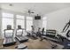 Well-equipped community gym featuring treadmills, elliptical machines, weights, and TV at 7472 E Paraiso Dr, Scottsdale, AZ 85255