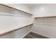 Spacious walk-in closet with built-in shelving, providing ample storage space at 7472 E Paraiso Dr, Scottsdale, AZ 85255