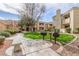 Community area with BBQs, seating, and grass at 7575 E Indian Bend Rd # 1036, Scottsdale, AZ 85250