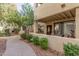 Apartment exterior showcasing a quaint patio and well-maintained landscaping at 7575 E Indian Bend Rd # 1036, Scottsdale, AZ 85250