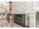 Close-up of a fireplace with decorative accents and a mantel at 7575 E Indian Bend Rd # 1036, Scottsdale, AZ 85250