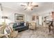 Inviting living room with a gray sofa, artwork, and neutral decor at 7575 E Indian Bend Rd # 1036, Scottsdale, AZ 85250