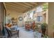 Inviting patio with comfortable seating, potted plants, and shade at 7575 E Indian Bend Rd # 1036, Scottsdale, AZ 85250