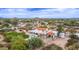 Sprawling estate showcasing a pool, covered parking, and lush turf, complete with white fencing and desert landscaping at 7650 E Culver St, Mesa, AZ 85207