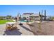 Enjoy the outdoors at the backyard dining area and pool that compliment the main house at 7650 E Culver St, Mesa, AZ 85207