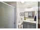 Bathroom with walk-in shower, vanity, framed mirror and modern fixtures at 7650 E Culver St, Mesa, AZ 85207