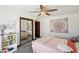 Charming bedroom showcasing a large mirrored closet and soft, natural light at 7650 E Culver St, Mesa, AZ 85207