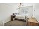 Bedroom featuring a fan, carpet, and window at 7650 E Culver St, Mesa, AZ 85207