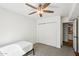 This bedroom features a fan, carpet, and closet at 7650 E Culver St, Mesa, AZ 85207