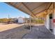 Covered area with concrete slab, providing versatile space with storage, and desert views at 7650 E Culver St, Mesa, AZ 85207