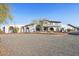 Stunning home featuring white stucco, red tile roof, arched windows and a circular drive at 7650 E Culver St, Mesa, AZ 85207