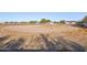 Spacious horse arena with natural dirt surface and white fencing, providing a large area for equestrian activities at 7650 E Culver St, Mesa, AZ 85207