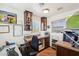 Home office with built-in shelves and desk featuring natural light at 7650 E Culver St, Mesa, AZ 85207