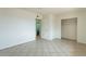 Spacious bedroom featuring tile floors, ensuite bathroom and closet at 8038 S 25Th St, Phoenix, AZ 85042