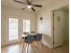 Cozy dining area with tile flooring, a modern light fixture, and easy access to outdoor patio at 8038 S 25Th St, Phoenix, AZ 85042