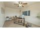 Well-lit office space featuring tile flooring, a ceiling fan, and a comfortable workspace at 8038 S 25Th St, Phoenix, AZ 85042