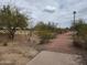 Meandering park path with mature shade trees and desert landscaping at 8038 S 25Th St, Phoenix, AZ 85042