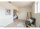 Bright sitting area with large window, tile floors, contemporary rug, stylish chairs and clothing rack at 8038 S 25Th St, Phoenix, AZ 85042