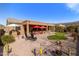 Expansive backyard boasting an entertainment area, low maintenance landscaping and scenic mountain views at 8157 E Apache Plumb Dr, Gold Canyon, AZ 85118