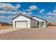 Charming single Gathering home with attached two car garage and neutral colored stucco at 9504 W Century Dr, Arizona City, AZ 85123