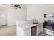 Contemporary kitchen with quartz counters, stainless appliances, and lots of light at 9504 W Century Dr, Arizona City, AZ 85123