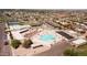 Aerial view of a recreation center with a pool, tennis courts, and parking at 10816 W Venturi Dr, Sun City, AZ 85351