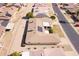 Aerial view of a single-Gathering home with a tile roof, solar panels, and desert landscaping at 10816 W Venturi Dr, Sun City, AZ 85351