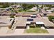 Aerial view of a well maintained neighborhood featuring single-story homes with solar panels and mature desert landscaping at 10816 W Venturi Dr, Sun City, AZ 85351