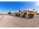 Townhouse exterior featuring low maintenance desert landscaping and security doors at 10816 W Venturi Dr, Sun City, AZ 85351