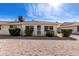 Townhouse exterior featuring low maintenance desert landscaping and security doors at 10816 W Venturi Dr, Sun City, AZ 85351
