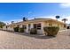 Townhouse exterior featuring low maintenance desert landscaping and security doors at 10816 W Venturi Dr, Sun City, AZ 85351