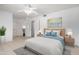 Serene bedroom with large bed, cool color accents, and access to ensuite bathroom at 10816 W Venturi Dr, Sun City, AZ 85351