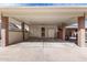 Covered carport featuring brick pillars, security doors, and extra storage space at 10816 W Venturi Dr, Sun City, AZ 85351