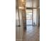 Inviting entryway with neutral tile flooring and abundant natural light streaming through the front door at 10816 W Venturi Dr, Sun City, AZ 85351