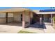 Home exterior showing a carport and well-kept facade with desert-friendly landscaping and solar panels at 10816 W Venturi Dr, Sun City, AZ 85351