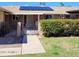 Charming single-story home featuring a well-maintained front yard with solar panels on the roof at 10816 W Venturi Dr, Sun City, AZ 85351