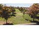 Scenic golf course with mature trees, green fairways, and the SCCC logo at 10816 W Venturi Dr, Sun City, AZ 85351