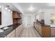 Well-lit kitchen featuring bright white appliances, stylish countertops, and abundant cabinet space for storage and meal prep at 10816 W Venturi Dr, Sun City, AZ 85351