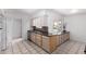Bright kitchen featuring classic cabinetry, black countertops and stainless steel appliances and an eat-in breakfast area at 10816 W Venturi Dr, Sun City, AZ 85351