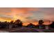 Community street view with colorful sunset sky and well-maintained homes at 10816 W Venturi Dr, Sun City, AZ 85351