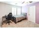 This cozy bedroom features a single bed, a window with shutters, and a modern desk at 10825 W El Cortez Pl, Peoria, AZ 85383