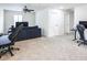 Spacious bonus room with plush carpet and ample space for gaming and relaxation at 10825 W El Cortez Pl, Peoria, AZ 85383