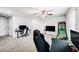 Bright bonus room with gaming setup, neutral carpet, and ceiling fan at 10825 W El Cortez Pl, Peoria, AZ 85383