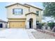 Two-story home featuring a two-car garage, covered entry, and desert landscaping in a well-maintained community at 10825 W El Cortez Pl, Peoria, AZ 85383