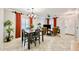Bright living area with tile floors, open dining space, large windows, and stylish furniture arrangement at 10825 W El Cortez Pl, Peoria, AZ 85383