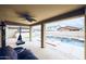 A covered patio area showcases a ceiling fan, furniture, and a pool area view at 10825 W El Cortez Pl, Peoria, AZ 85383